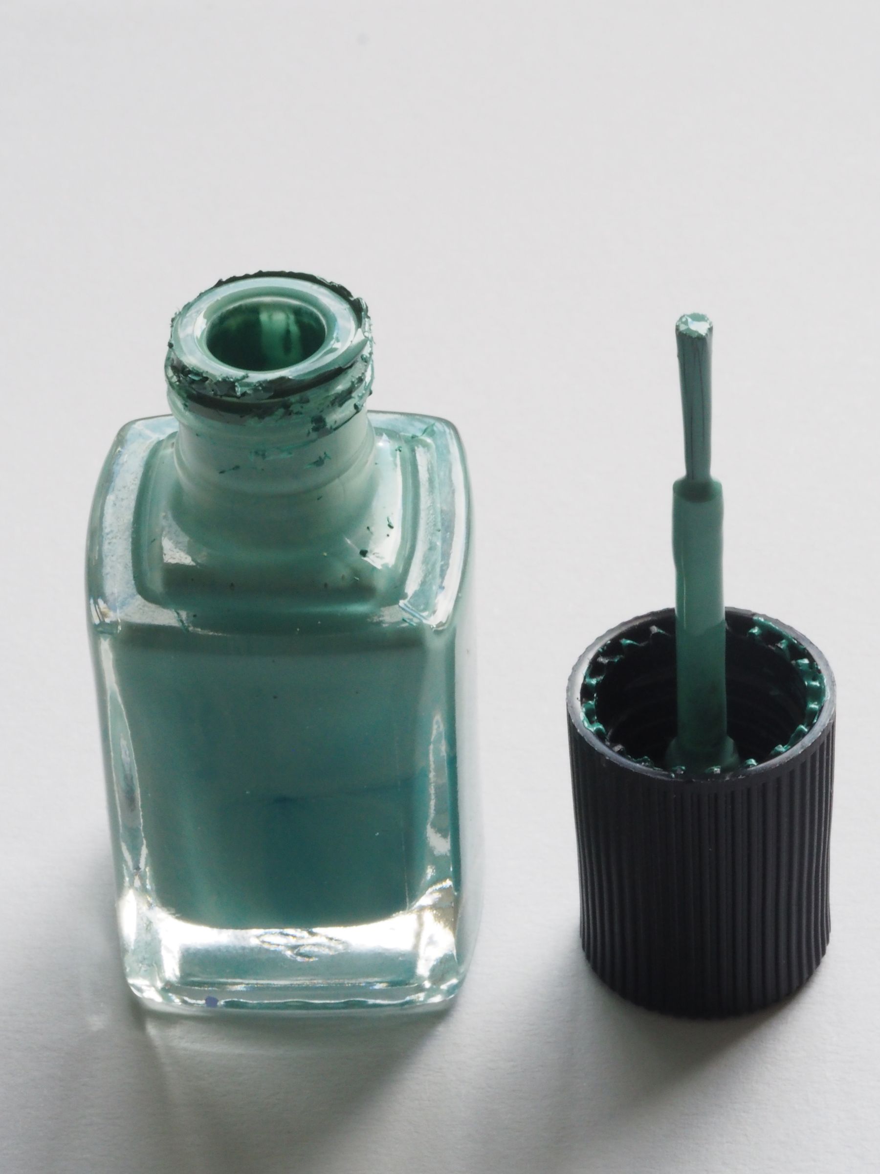 Open bottle of nail lacquer